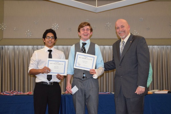 Beard (r) recognizes Rayson Pinto (l) Brendan Boylan as the first place team at the Tidewater Science and Engineering Fair in March.
