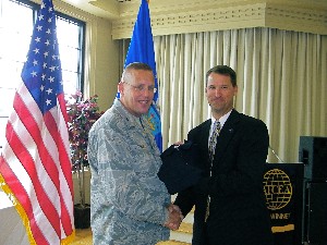 Bill Marion (r), chapter vice president, presents Col. Dan Johnson, USAF, commander, 480th Intelligence, Surveillance and Reconnaissance Wing, Langley Air Force Base, Virginia, with a token of thanks for speaking at the chapter's meeting. The colonel was the guest speaker in September.