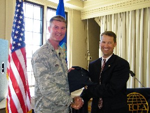 Bill Marion (r), chapter president, presents Col. David Uhrich, USAF, director, C4 Systems, and chief information officer, U.S. Forces Command, with a token of thanks for his presentation at the October luncheon.