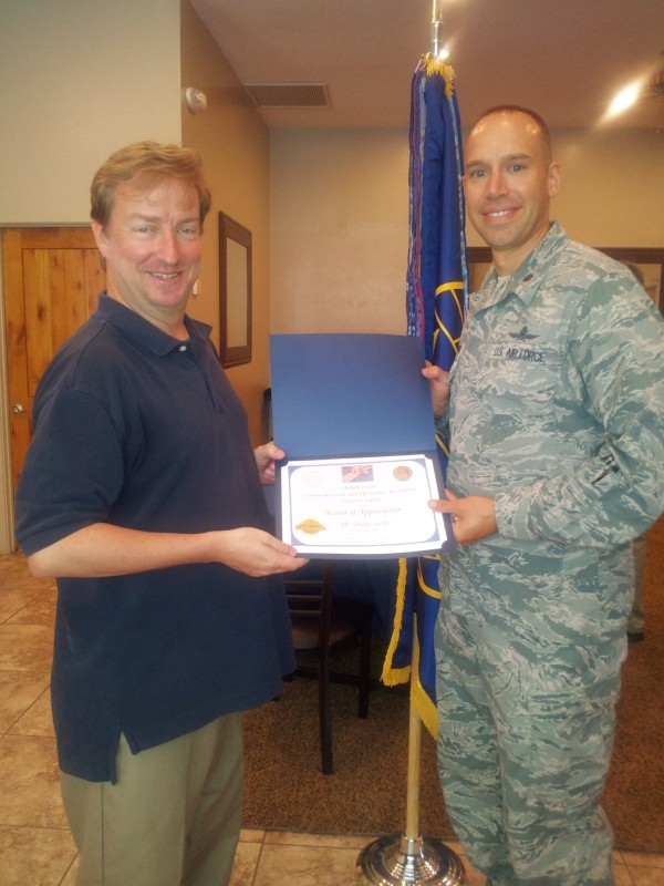 Chapter President Maj. Chad Richardson, USAF (r), presents a certificate of appreciation to Brett Scott, founder of the Arizona Cyber Warfare Range, who spoke at the chapter's October luncheon.