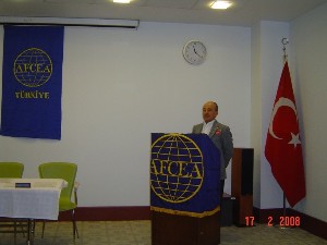 Col. Yalç1n Önyürü, TUA (Ret.), chapter president, thanks members of the general assembly for their contributions during his opening remarks at the February meeting.