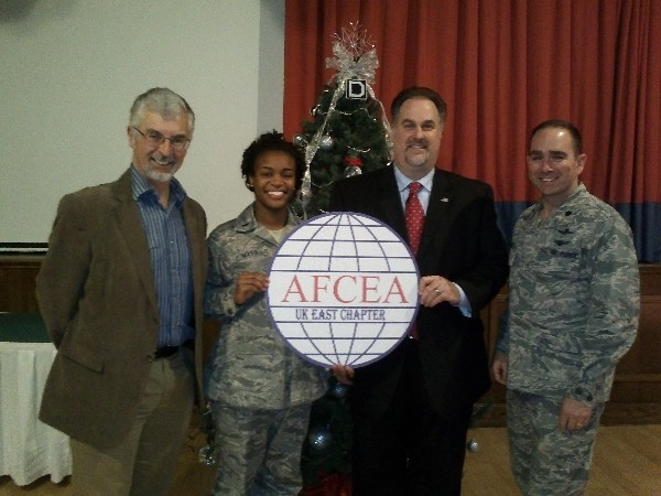Together at the December meeting are (l-r) Bruce Wynn, regional vice president for the United Kingdom; 1st L.t Latiria Mayo, USAF, chapter vice president; Cameron Chehreh, General Dynamics Information Technology/Intelligence Solutions Division; and Lt. Col. Albert Franke, USAF, chapter president.