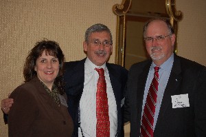 Alan Balutis, president of the Washington chapter, poses with representatives from new corporate members The Olive Group and The Podmilsak Group. Attending on their companies' behalves were (l-r): Marianne Meins of The Olive Group, Alan Balutis, chapter president, and William J. Amshey, Jr. of The Podmilsak Group.