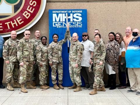 Soldiers and civilian personnel at Bayne-Jones Army Community Hospital celebrate the rollout of the Military Health System’s modernized electronic health record platform GENESIS. The Solutions Delivery Division at the Defense Health Agency is supporting the agency’s next big effort following the deployment of MHS GENESIS, Digital Front Door, which will allow patients to use their own devices as part of a mobile or at-home health suite of tools. Credit: Jean Graves, Medical Readiness Command
