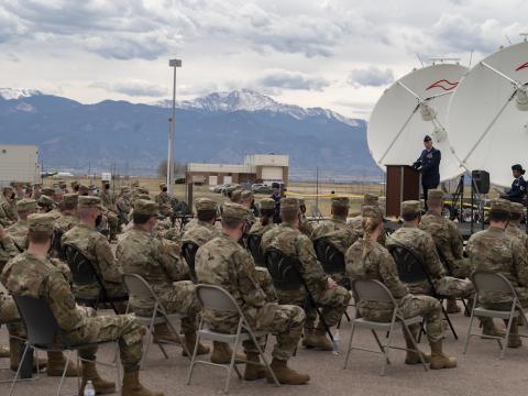 Col. Agustin Carrero, commander, 710th Operations Group, speaks during the 380th Space Control Squadron's ribbon-cutting ceremony for the Bounty Hunter 2.0 training system at Peterson Air Force Base, Colorado, May 1, 2021. The Space Force is succeeding with its Integrated Mission Delta concept to bring sustainment and acquisition into the delta structure. Credit: Tech. Sgt. Frank Casciotta, 310th Space Wing Public Affairs