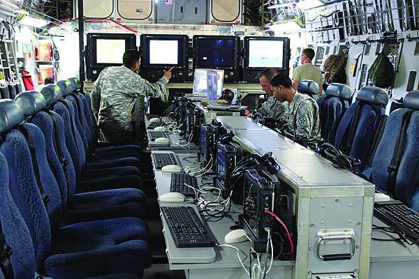 The full Joint Airborne Command and Control/Command Post (JACC/CP) system features work stations and includes a Microsoft Window-based computer tablet and four large monitors for viewing relevant information, data feeds or a common operating picture. The JACC/CP can be rolled on/rolled off a C-17 aircraft for a quick initial setup.
