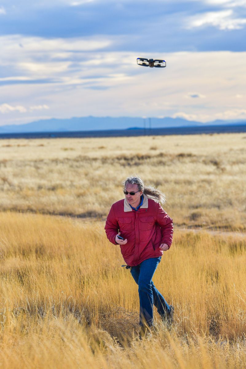 An unmanned aircraft system tracks and follows Sandia National Laboratories researcher David Novick, who is leading a project to identify, track and capture enemy UAS during flight. Photo by Randy Montoya