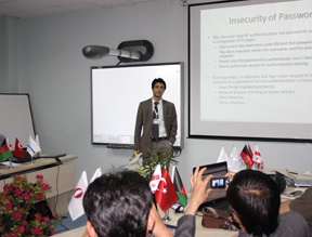 An instructor from Georgia teaches a class to a group of Afghan cyberprofessionals. 