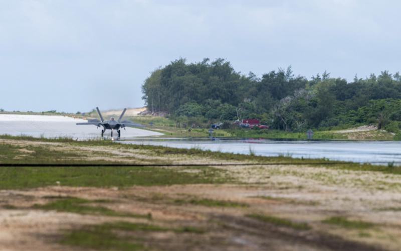 A U.S. Air Force F-22 Raptor assigned to the 525th Fighter Squadron completes agile combat employment (ACE) maneuvers during Operation Pacific Iron 2021 at Northwest Field, Guam, in July. The austere conditions of the former World War II airfield offered ideal conditions for airmen to train in ACE. Credit: Air Force photo by Senior Airman Alexandra Minor.