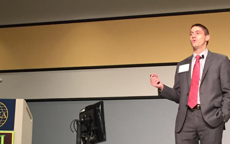 Paul Tilghman, program manager, Microsystems Office, DARPA, speaks at the AFCEA/GMU Critical Issues in C4I Symposium.