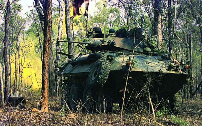 U.S. Marines from 3rd Light Armored Reconnaissance Company train the turret of their Light Armored Vehicle toward targets at the Shoalwater Bay Area Training Area in Queensland, Australia. Australia is one country in the Asia Pacific region expected to join the Coalition Interoperability Assurance and Validation working group.