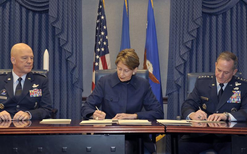 The U.S. Space Force will grow to about 16,000 warfighters, civilians and contractors. Top military leaders, including, Gen. John Raymond (l), commander of United States Space Command and Air Force Space Command; Secretary of the Air Force Barbara Barrett (c); and previous Chief of Staff of the Air Force Gen. David L. Goldfein, sign memorandums to authorize the service last December. Credit: Secretary of the Air Force Public Affairs, Photo by Tech. Sgt. Robert Barnett