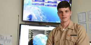 Ensign Edward Hanlon, USN, along with a group of midshipmen, helped create the robotic satellite repair system AMODS, which will be launched into space for testing this summer.