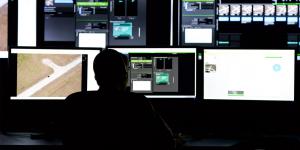 Members of the Air Force Research lab work on a new enhanced reporting, narrative event streaming tool built in cooperation with business and academia. The tool is aimed at streamlining tasks performed by intelligence analysts, which will be essential for future intelligence processes. Photo by Wesley Farnsworth