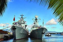 The People’s Liberation Army Navy (PLAN) Luhu-class destroyer Qingdao (l) and the Jiangkai-class frigate Linyi are moored at a dock while visiting Joint Base Pearl Harbor-Hickham in Hawaii in September. The newest PLAN destroyer, an 052D model, incorporates lessons learned from these ships alongside innovative technologies.