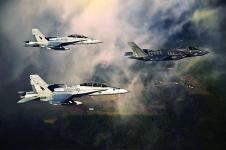 A U.S. Marine Corps F-35 aircraft is escorted by two Marine F/A-18 Hornets as it flies toward Eglin Air Force Base, Florida. Later this year, the Defense Department will establish a program of record to ensure communications between different generations of fighter aircraft, and that program will feed into the Joint Aerial Layer Network vision.