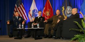 From l to r, service chiefs from the U.S. Coast Guard, Navy and Marine Corps address critical issues facing the U.S. military. Photo by Mike Carpenter