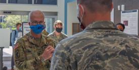 Lt. Gen. Ronald Place, USA, director of the Defense Health Agency (DHA), speaks with a U.S. Airman assigned to the 4th Medical Group at Seymour Johnson Air Force Base, North Carolina, in August. The director is leading the DHA's efforts to improve the care of warfighters, including through the use of advanced technology, where appropriate. Credit: U.S. Air Force photo by Senior Airman Kylee Gardner