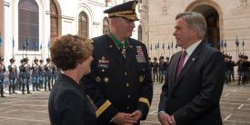 Gen. Raymond T. Odierno, USA (Ret.) (c) , and his wife, Linda (l), speak in 2013 with David Thorne, former U.S. ambassador to Italy, during a ceremony at the Italian army headquarters in Rome, when Gen. Odierno received the Order of Merit of the Italian Republic. The general passed away last weekend at age 67. Credit: U.S. Army photo by Staff Sgt. Teddy Wade
