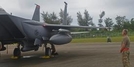 An airman from deployed from Mountain Home Air Force Base, Idaho, examines an F-15E Strike Eagle during preflight inspections at Tinian International Airport, Tinian during Pacific Iron 21 in August. To conduct such agile, more lethal movement of forces and airpower in the region, more software solutions are needed. Credit: U.S. Air Force photo by Tech. Sgt. Benjamin Sutton