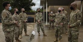 Lt. Gen. Timothy Haugh, USAF (right c), commander, 16th Air Force (Air Forces Cyber), and Chief M. Sgt. Kenneth Bruce, USAF (r), command chief, 16th Air Force, discuss the 2nd Combat Weather Systems Squadron efforts during a visit at Hurlburt Field, Florida, in April. The command, which spent the last two years integrating information warfare capabilities including weather intelligence, sees zero trust as a core technology. Credit: USAF photo by Senior Airman Robyn Hunsinger