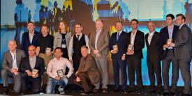 NCIA General Manager Kevin Scheid (2nd row, l) and AFCEA Europe General Manager Maj. Gen. Erich Staudacher, GEAF (Ret.), (2nd row, 3rd from r) congratulate the 10 winning participants in the 2018 NITEC Defence Innovation Challenge. Each company had five minutes to present their product to attendees. The competition drew 35 submissions. Photo courtesy of Chuck Helwig