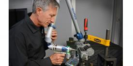 Stephen Cox, chief engineer at SPAWAR Systems Center Pacific’s RESTORE Lab in San Diego, uses a laser scanner. Credit: Alan Antczak