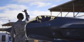 Master Sgt. Thomas Puckett, USAF, 7th Aircraft Maintenance Squadron, Lightning Aircraft Maintenance Unit section chief, sends off an F-35 Lightning II fighter jet assigned to the 6th Weapons Squadron at Nellis Air Force Base, Nevada. The Air Force has made the Shadow Operations Center at Nellis the location validating its Joint all-domain command and control. U.S. Air Force photo by Airman 1st Class Andrew Sarver