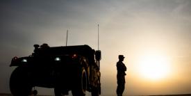 A U.S. Army soldier stands outside a Humvee before the start of the Dasman Shield live fire exercise in Kuwait in February. During the exercise, the military looked at the beginnings of all domain operations, including air-to-ground command control, as well as partner interoperability with Kuwaiti forces. U.S. Air Force photo by Senior Airman Kevin Tanenbaum
