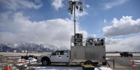 The Department of Defense is in the process of rolling out 5G communications at its military bases, including at Hill Air Force Base, Utah, pictured with a 5G mobile test station on the flight line to examine 5G-related avionics testing. The plan, however, is to leverage commercial sector 5G-related technologies and networks outside the United States, including cloud capabilities. U.S. Air Force photo by R. Nial Bradshaw