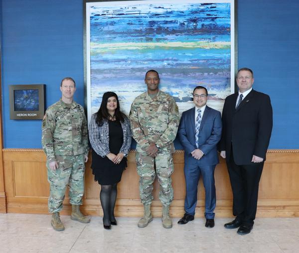 All five panelists pose for a photo at Waters Edge Event Center at the March event. Photo credit: Kathryn Bailey, Public Affairs Specialist, PEO C3T