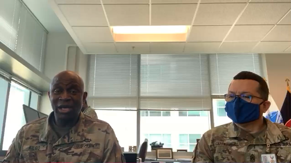 In June, Maj. Gen. Mitchell Kilgo, USA (l), delivers opening remarks for the U.S. Army Signal Corps' Virtual Birthday Celebration. Pictured with him is Command Sgt. Maj. Frank Gutierrez, USA.