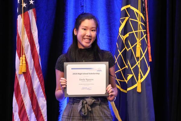 Emily Nguyen from Rising Sun High School, North East, Maryland, receives the High School Scholarship at the chapter's August event.