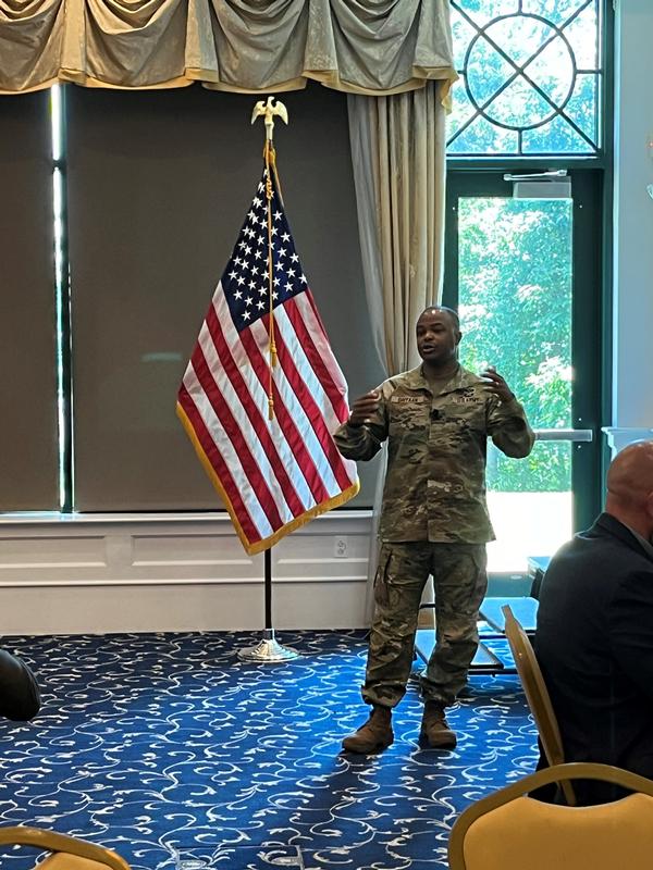 Daiyaan presents at the June luncheon. Photo Credit: PEO C3T Public Affairs Office