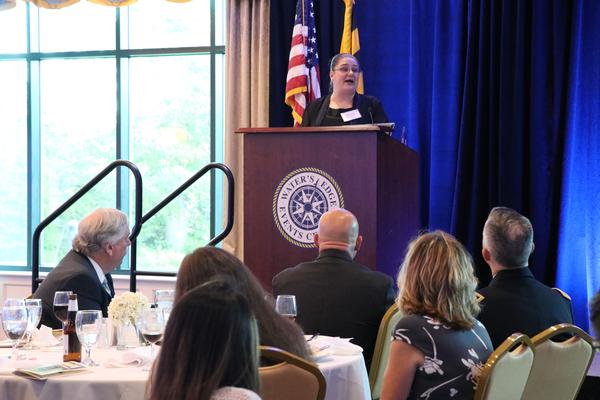 Guest speaker Kerry Anne Kedzierski, a physics teacher at North East High School, speaks to the benefits of the chapter's STEM grants at the May event. 