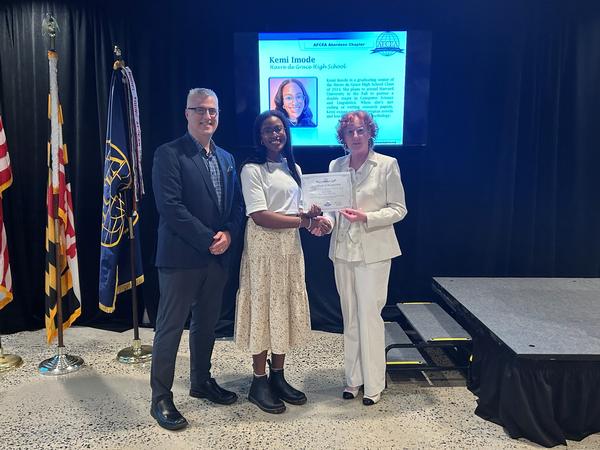 In June, Vice President of Education David Patrick (l) and DSA Chief Operating Officer Kathleen Kirk (r) present a scholarship award to Kemi Imode, Havre de Grace High School Class of 2024.