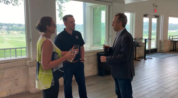 Alyssa Ott, Justin Newell and Jason Gallegos chat after setting up the venue for the chapter's first Young AFCEAN Tech Talk of the year in May. They are all part of the YAC committee helping to grow the chapter's 40 and under footprint in Military City, USA.