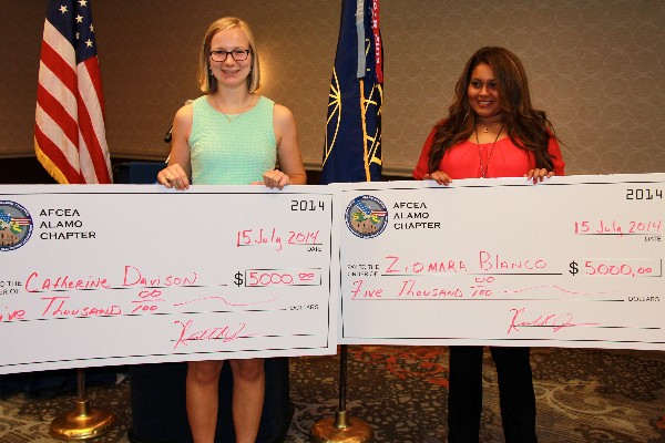 Catherine Davison (l) and Ziomara Blanco each received $5,000 STEM Teachers Scholarship checks at the Alamo chapter's luncheon in July. Blanco was named one of the 2014 STEM Teachers Scholarship winners by AFCEA International and Davison received a similar honor at the chapter level.