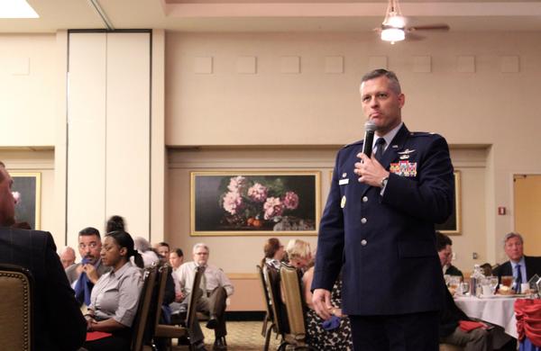 Col. Eric Delange, USAF, commander, 688th Cyberspace Wing, talks cyberspace challenges to chapter members and attendees during the September luncheon.