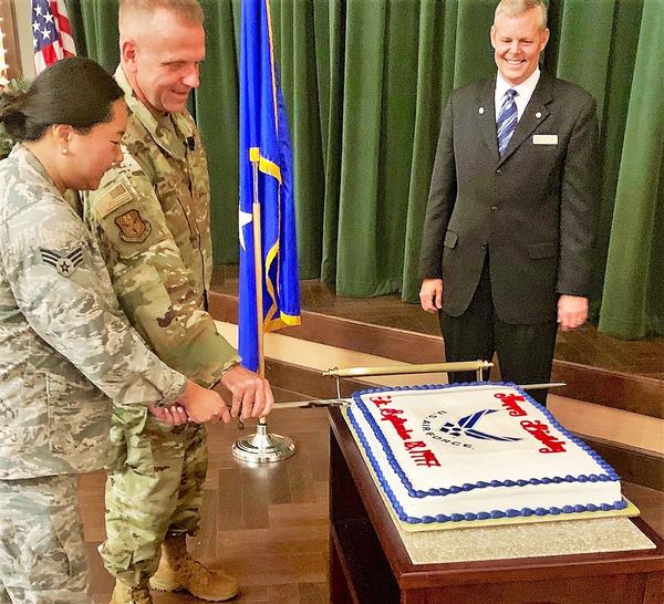 Maj. Gen. Timothy Lunderman, USAF, Air National Guard assistant to the commander, 24th Air Force and Air Forces Cyber, Joint Base San Antonio-Lackland, Texas, and Senior Airman Christine Parks, USAF,  ceremoniously cut the Air Force's 72nd birthday cake during the chapter's September luncheon.