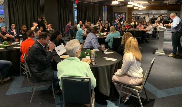 The chapter's keynote speaker Jason Edwards, compliance director, USAA Cybersecurity, welcomes attendees to the chapter's Annual Mentor Protégé Night in October. 