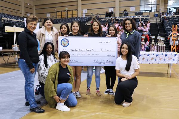 In October, members of the IDEA [Individuals Dedicated to Excellence and Achievement] Benito College Prep team pose with Karen Rolirad, chapter vice president of scholarships and educational grants, after receiving their $3,000 scholarship. The award was deemed the 