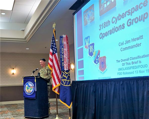 Col. James Hewitt, USAF, commander, 318th Cyberspace Operations Group, 67th Cyberspace Wing, Joint Base San Antonio-Lackland, briefs the chapter members and attendees on cyberspace operations today during their January luncheon.