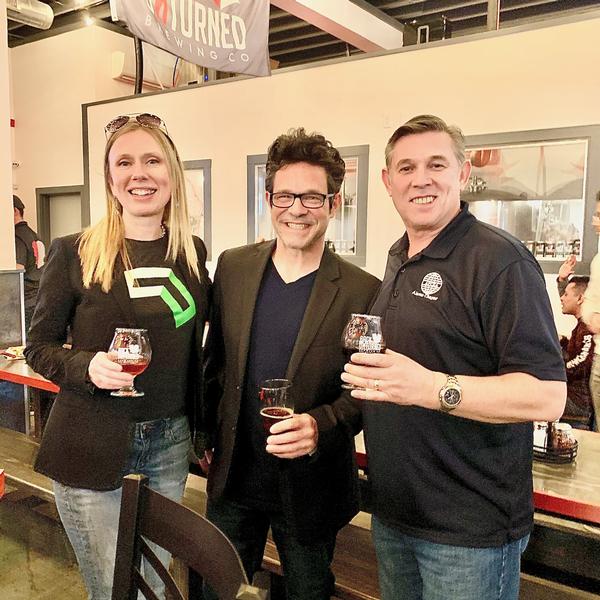 Bill Robinson, chapter vice president of memberships and mentor, poses with Faith and Stephan Kane at the chapter's first YAC social event of the year. Tech on Tap allows the 40 and under group to mingle with their peers and mentors in a social setting.