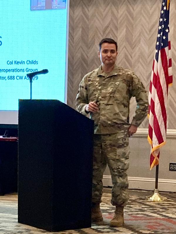 Col. Kevin Childs, USAF,  commander, 26th Cyberspace Operations Group, and director, A5/8/9, 688th Cyberspace Wing,  speaks to the chapter on the importance of partnerships during its October monthly luncheon.