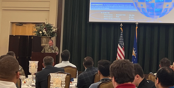 Col. Jonathan M. Boling, USAF, commander, 616th Operations Center (616 OC), speaks on ways the OC maintains competitive edge at the September luncheon.