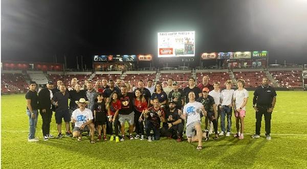 Both Team USA Armed Forces and Bethesda University join together for a  group picture after their friendly game at the 11-area field on June 24.  Team USA has played 10 friendly games