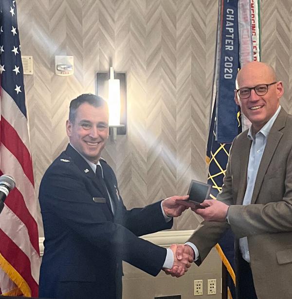 Col. Jason Turner, USAF, Operations and Communications Directorate (A3/6) deputy director for Force Development at Headquarters Air Education and Training Command, Joint Base San Antonio-Randolph, Texas, poses with Chapter President Chris Kinne at the January Luncheon.