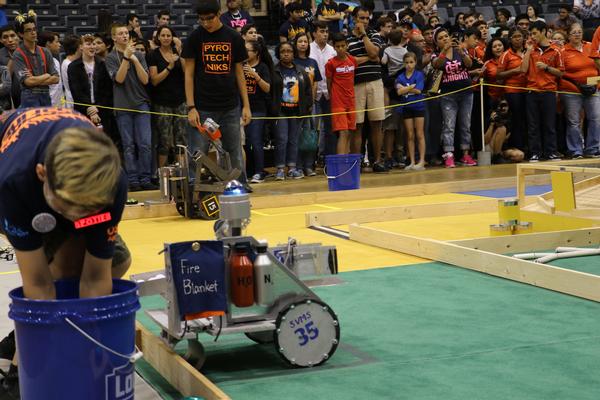 One of 700 San Antonio students from 38 middle and high schools competes in October's SABEST with his team's remote-controlled robot. 
