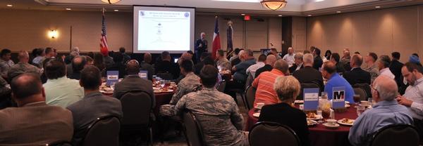 Chapter members of May's luncheon listen as 25th Air Force A6 and 625th ACOMS commander, Col. Michael Cote, discusses intelligence, surveillance and reconnaissance.